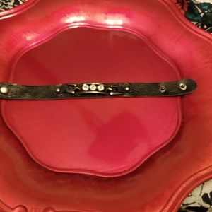 Beautiful Rhinestones with gun metal accents on a flexible soft material.